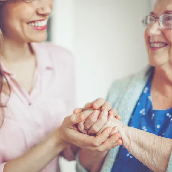 nurse joining hands with patient